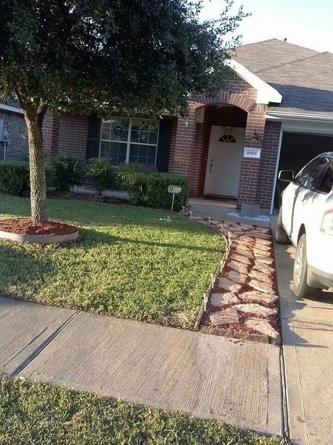 I want to do a rock walk for us next to our driveway like this. A friend of ours did this one and it looks really good. I'm thinking we need the extra walkway space for us. Walkway Beside Driveway, Walking Path Next To Driveway, Flagstone Driveway Extension, Pathway Next To Driveway, Path Next To Driveway, Landscape Pavers Ideas Walkways, Extend Driveway Ideas, Pavers Next To Driveway, Walkway Next To Driveway