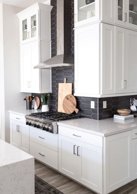 25 Black Kitchen Backsplashes Guaranteed to Inspire | Hunker Black And White Kitchen With Backsplash, Backsplash For Black And White Kitchen, Subway Tile Black Grout Kitchen, White Kitchen Black Backsplash, Dark Backsplash White Cabinets, Black And White Kitchen Backsplash Ideas, Dark Kitchen Backsplash Ideas, Picket Backsplash, Black Kitchen Backsplash