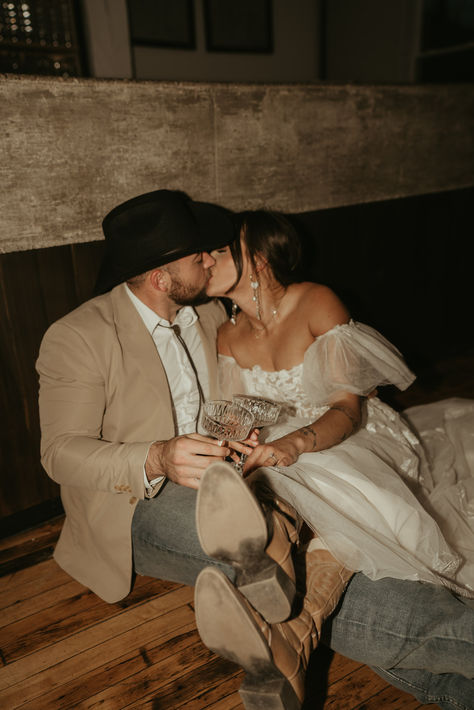 Country Western photo ideas, country wedding ideas, western wedding photo ideas, cowboy hat, cowboy boots wedding, wedding cowboy boots, wedding cowboy hat, flash photography, bar wedding photos, western wedding ideas, big wedding dress Cowboy Boots Wedding Photos, Wedding In Cowboy Boots, Hat Bar Wedding, Bride With Cowboy Boots, Cowboy Marriage, Western Wedding Detail Shots, Western Flower Girl, Western Wedding Pictures, Wedding Ideas Big