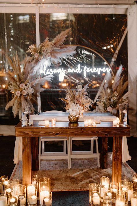 Wedding Reception Sweetheart Table with Pillar Candles and Boho Pampas Arrangement Centerppiece | Custom Neon Sign Pampas And Candles Wedding, Boho Candles Wedding, Sweetheart Table Ideas Boho, Boho Head Table Wedding Decorations, Mr And Mrs Sweetheart Table, Boho Sweetheart Table Backdrop, Wedding Sweetheart Table Ideas Boho, Boho Wedding Sweetheart Table, Boho Head Table Decor