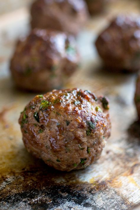 NYT Cooking: Making great meatballs is all about memorizing a basic ratio that you can adjust to suit your taste. Start with a pound of ground meat — any kind will work, even fish if you want to take it in that direction. Add 1/2 cup bread crumbs for lightness, a teaspoon of salt, and an egg to bind it together. That’s all you need. Pepper and other spices, chopped herbs%... Nyt Cooking, Chicken Meatballs, Ground Meat, Meatball Recipes, Kitchen Tips, Classic Food, Bread Crumbs, Meat Recipes, The Oven