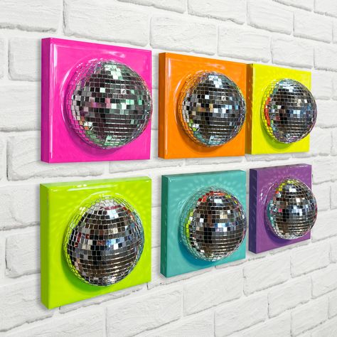 Follow the call of the disco ball! Add some sparkle to any room with this set of bright rainbow half disco ball 3D wall arts. Bundle set includes 1 each of 6 colors. Pink, Orange, Yellow, Green, Turquoise, and Purple. Colors are bright neon shades. If you would like custom colors please include a message with your order. Each square board is 5"x5" Hand assembled and finished with glossy resin on a wood panel frame. Each piece is made on a board with recessed back for easy hanging. Sets are made Salon Suite Decor Colorful, Austin Powers Decor, Funky Frames Wall Art, Colorful Maximalist Decor Apartment, Diy Retro Wall Art, Pop Culture Decor, Dopamine Decor Living Room, Disco Room Decor, Disco Ball Room Decor