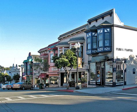 Wonderful pic of my favorite little town -Pacific Grove. I've been on that block so many times, and never tire of it.   Victorian storefronts on Lighthouse Avenue in Pacific Grove Purple Building, Pacific Grove California, Monterey Peninsula, Monterey California, Carmel Valley, Victorian Mansions, California Vacation, Monterey Ca, Pacific Grove