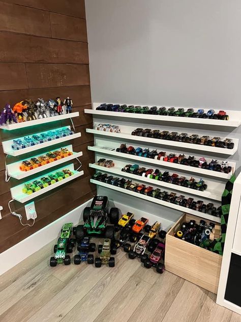 Toy Train Organization, Dinosaur And Car Bedroom, How To Organize Monster Trucks, Monster Truck Garage Diy, Monster Truck Toy Storage Ideas, Monster Truck Wall Storage, Monster Truck Organization Boy Rooms, How To Store Monster Trucks, Diy Monster Truck Storage