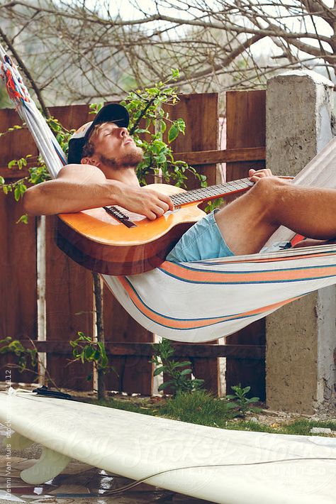 Young man enjoys playing guitar while laying in a hammock by Denni Van Huis #stocksy #realstock Life is a Hammock Hammock Senior Pictures, Man In Hammock, Playing Guitar Aesthetic, Guy Playing Guitar, Man Playing Guitar, Aesthetic Guitar, Surfer Vibes, Guitar Aesthetic, Hippie Men