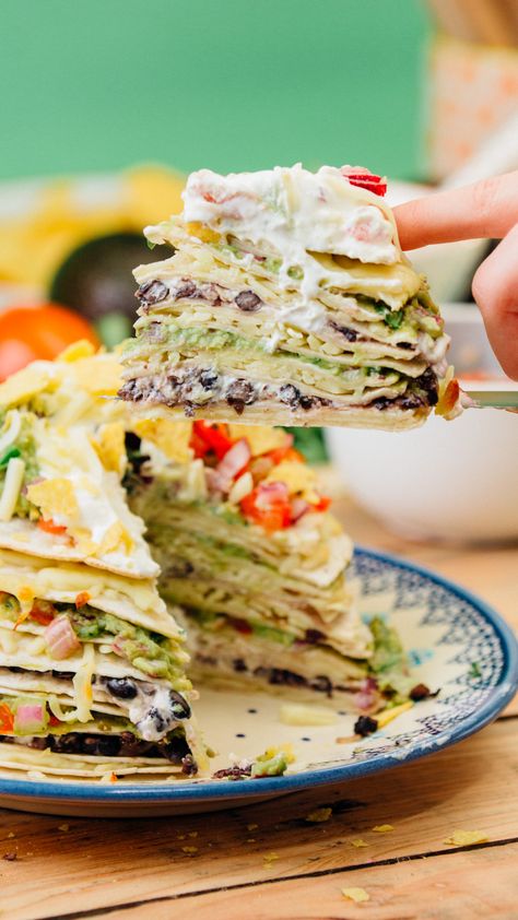 Kate's Mexican inspired tortilla stack is the perfect dish to feed tonnes of hungry friends at your next movie night! It's stacked high with cheese, guacamole and all your favourite toppings! Tortilla Stack, Mexican Favorites, Mexican Tortilla, Mexican Night, Your Next Movie, Recipes Authentic, Filo Pastry, Tortilla Wraps, Corn Chips