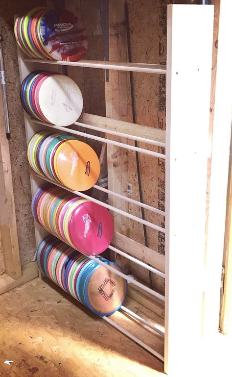 I made this custom disc golf rack for my husband to store his disc collection. It's not quite finished, but it's functional! Disc Golf Storage, Disc Golf Humor, Golf Storage, Disc Golf Gifts, Disc Golf Bag, Disc Golf Basket, Golf Ball Crafts, Disc Golf Shirt, Golf Baby