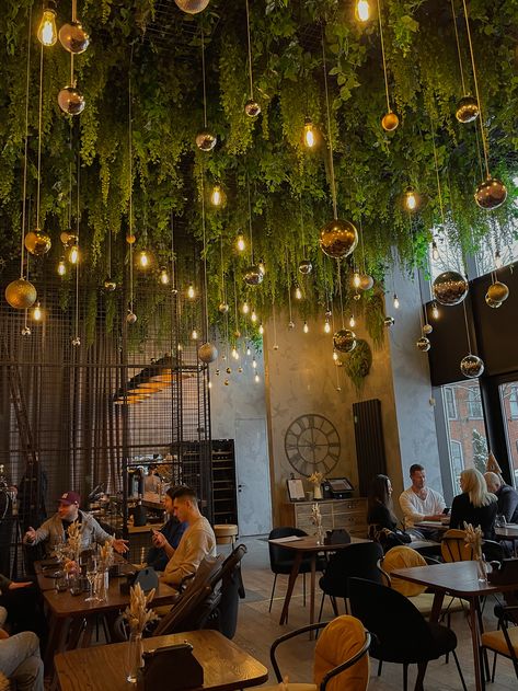 Industrial Boho Restaurant, Plant Ceiling Decor Restaurant, Small Modern Restaurant Design, Jungle Bar Design, Restraunt Interior Design Ideas, Indoor Garden Cafe, Bar With Plants, Tropical Restaurant Design, Restaurant Greenery