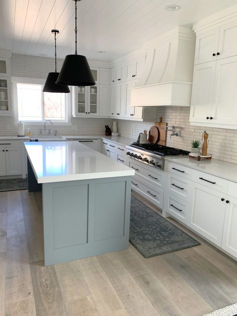 Sherwin Williams High Reflective White, a popular white for cabinets, walls, trims, exteriors and more. Learn about it with Online Paint Colour expert, Kylie M Interiors. Shown here in a kitchen with Magnolia Teak Cups gray on the island, whitewash wood floor, subway tile backsplash and black pendants over the island. Client photo #paintedcabinets #whitepaint #bathroom #diy #updateideas #kitchenisland #bestpaintcolours #kylieminteriors #kyliemedesign #edesign #kitchen #whitekitchen High Reflective White Cabinets, Behr Light Grey Paint Colors, True Grey Paint Color, Behr Paint Colors Grey, High Reflective White, Best Cabinet Paint, Black Pendants, Kylie M Interiors, Best Gray Paint Color