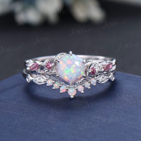 Nature Inspired  Jewelry, Twig Opal Ring Set , 10K Rose Gold, Hexagon Cut Ring, Branch Engagement Ring, Pink Tourmaline , October Birthstone, Birthday Gifts Main Ring : 6*6mm hexagon cut Lab white opal. Side stone : Pink Tourmaline Matching Band: moissanite and opal. Material Metal: 925 sterling silver, Solid 14k/18k gold, platinum PLEASE choose silver or platinum if you are allergic to nickel. This jewelry is made to order, it can be made with any gemstone/metals. 2-3 weeks to finish. Default S Branch Wedding Ring, Fantasy Jewelry Magic, Opal Wedding Ring Set, Pink Rings, Opal Engagement Ring Rose Gold, Branch Engagement Ring, Pink Opal Ring, Pretty Engagement Rings, Wedding Ring Unique