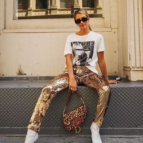 sequin pants, dior saddle, white boots, graphic tee Gold Pants Outfit, Scarf Fashion Outfit, Fashion Magazine Typography, Nyfw Outfits, Street Style Nyc, Fashion Portfolio Layout, Gold Pants, Nyc Street Style, Sequin Pants