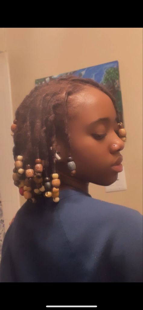 Hairstyles With Wooden Beads, Locs With Wooden Beads, Short Loc Styles With Beads, Beads On Starter Locs, Beads On Short Locs, Locs With Beads And Shells, Wooden Beads Hairstyles, Locs Side Profile, Beads In Locs