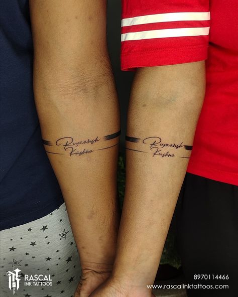 #couplearmbandtattoo #couplebandtattoo #couplebandtattoos #couplebandtattoodesign #bandtattoos #armbandtattoo #besttattoostudioinbangalore #besttattooshopinbangalore #besttattooshop #bangaloretattoostudio #bangaloretattooartist #bangaloretattooartists #besttattoowork #besttattooartists #rascalinktattoostudio #rascalinktattoos #tattoo #tattoos #tattoodesign Couple Arm Band Tattoos, Name Armband Tattoo, Band Tattoo With Name, Couple Name Tattoos, Simple Unique Tattoos, Tattoo Armband, Name Tattoo On Hand, Name Tattoos On Arm, Partner Tattoos