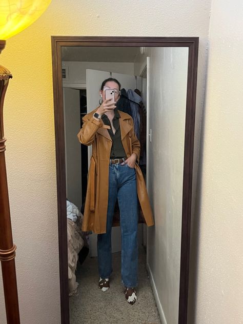 Brown tan leather trench coat, wide leg jeans, cow print booties Fall trench outfit Styling cow print boots Cow Print Boots Outfit, Leather Trench Coat Outfit, Print Boots Outfit, Cow Print Boots, Fall Trench, Trench Outfit, Gloomy Sunday, Print Boots, Outfit Styling