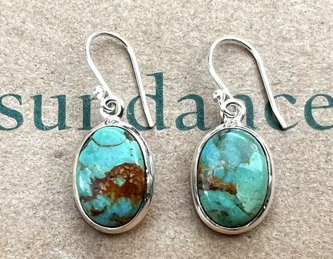 New Sundance Catalog exclusive Kingman turquoise "Lake Havasu Earrings" - classy and stunning! Sundance price $158 + tax + $9.95 S/H = $182.17 Artisan hand crafted exclusively for Sundance Catalog  Brightly colored teal Kingman turquoise stones with natural tan matrix and variations Beautiful gleaming silver bezel Open Sterling silver frame keep earrings lightweight  Length just under 1-1/4" Note that color tones can vary considerably between phone screens and monitors The Kingman Turquoise Mine in Arizona is one of the oldest turquoise mines in America. Kingman turquoise was discovered by prehistoric natives well over 1000 years ago. It is known for its beautiful sky-blue color and produces many variations of turquoise. SAVE TREES! Sundance earring card included ONLY UPON REQUEST -- pleas Save Trees, Silver Turquoise Jewelry, 1000 Years, Lake Havasu, Earring Card, Oval Earrings, Sundance Catalog, Phone Screens, Handcrafted Artisan Jewelry