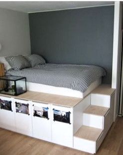 If you want extra storage, a raised bed is the way to go. Nine sturdy IKEA kitchen cabinets hold personal items. #KingSizeBed Diy Seng, Ikea Apartment, Diy Storage Bed, Murphy Bed Ikea, Kura Bed, Diy Platform Bed, Murphy Bed Plans, Bed Platform, Diy Bed Frame