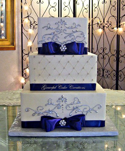 Elegant Square Wedding Cake with Purple Ribbon and Silver Scrolls Square Wedding Cakes Elegant, Wedding Cake With Purple, Royal Blue Wedding Cakes, Square Wedding Cake, Cakes Elegant, Wedding Cakes Elegant, Square Wedding Cakes, Purple Wedding Cakes, Wedding Cakes Blue