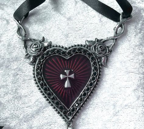 A splendour of Swarovski crystals and enamel encrust this lavish icon to the suffering. A dramatic piece for the romantic at heart. A large pewter heart pendant with translucent red enamelled sunburst centre. Finished with a black Swarovski crystal dropper. Made by Kiss of a red rose with inspiration from Alchemy Gothic. The choker comes with a red velvet gift pouch. Claire Core, Goth Ideas, Alchemy Gothic, Gothic Pendant, Dark Jewelry, The Sacred Heart, Heart Choker, Rose Rouge, Crystal Necklace Pendant