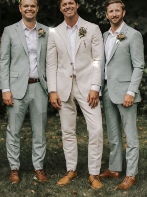 Cream And Sage Wedding Suit, Tan Groom Suit Beach Wedding, Wedding Color Schemes Bride And Groom, Tan Groom With Grey Groomsmen, Beige Tuxedo Wedding Groomsmen, Green Groomsman And Bridesmaid, Champagne Wedding Colors Groomsmen, Men Tux Wedding Groom Outfit, Brown Suit Sage Green Tie