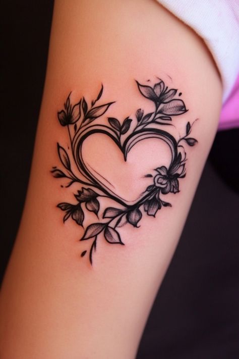 Floral heart tattoo on an arm with intricate black ink details. Stained Glass Heart Tattoo, Cartoon Heart Tattoo, Creative Heart Tattoo, Heart Vine Tattoo, Heart Cover Up Tattoo, 2 Hearts Tattoo, Heart On My Sleeve Tattoo, Cute Heart Tattoos, Heart With Flowers Tattoo