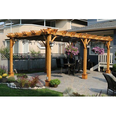 The Pergola is ideal for a large family enjoying a meal around the table or for some shade by the pool. This pergola is precut and easy to assemble. Size: 12 ft. W x 20 ft. D | Outdoor Living Today Solid Wood Pergola w/ Canopy Wood in Brown, Size 108.0 H x 258.0 W x 20.0 D in | Wayfair Pergola With Retractable Canopy, Backyard Sanctuary, Cedar Pergola, Wood Pergola, Retractable Canopy, Outdoor Living Design, Pergola Canopy, Backyard Pergola, Pergola Kits