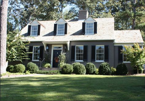 Three dormer cape cod with front door awning House With Black Shutters, American Settlers, Brick House Colors, Cape Cod Exterior, Cape Cod House Exterior, Modern Cape, Painted Brick Exteriors, Gabled Roof, House Awnings