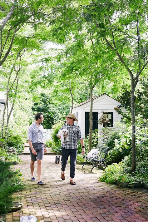 couple with dogs strolling through garden of weekend home Orchard Garden, New Home Owner, Honey Locust, Thomas O'brien, Outdoor Oven, Outdoor Dining Room, Dream Yard, Paved Patio, House Extension Design