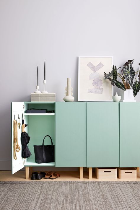 This entryway console is built from two unfinished wood cabinets, which are painted in a soft green. We added wooden legs to elevate the pieces and make room underneath for more storage; you can also mount the cabinets on the wall or stack them.  #marthastewart #organization #declutteringtips #homedecorideas #details Entryway System, Ikea Ivar Cabinet, Elegant Entryway, Mudroom Organization, Ikea Ivar, Entryway Storage, Entryway Console, Entryway Organization, 아파트 인테리어