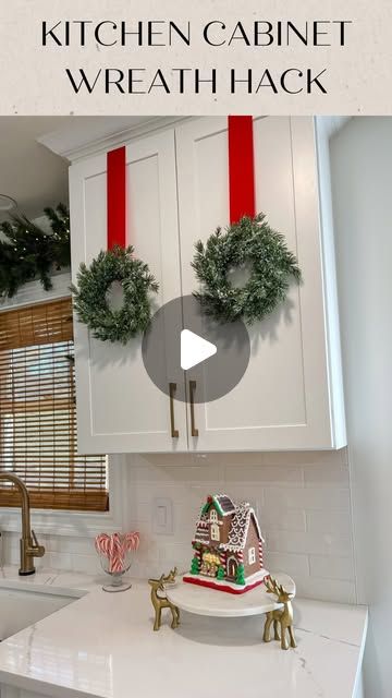 Jessica Cole on Instagram: "Here’s is an easy hack for hanging wreaths on your kitchen cabinets! No need to use damaging tape or screws!!   What you need:  Mini wreaths  Ribbon to hang  Hot glue  Command strips- mini hooks  Measuring tape   Directions:  1) measure your cabinet height and decide what length ribbon you need to cut  2) glue the end of the ribbon to the back of the wreath  3) measure the width of your cabinet and make a tiny pencil mark on the inside of the cabinet- marking the center 4) install the command hook *hook facing down* to the center of the inside of the cabinet (be sure you don’t install at the very top, or you won’t be able to close your cabinet) I installed it at the top of the panel.  5) fold the ribbon in half, and cut a tiny slit - this will be where the hook Mini Christmas Wreaths On Cabinets, Wreath For Kitchen Cabinets, Hanging Wreaths On Cabinet Doors, How To Hang Wreaths On Kitchen Cabinets, Wreath In Bedroom, Wreath On Kitchen Cabinets, Ribbon On Cabinet Doors, Cabinet Wreath Kitchen, Mini Wreaths On Kitchen Cabinets