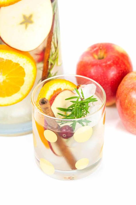 Fall spices, herbs and fruits come together in a pitcher of Thanksgiving Infused Spa Water to make a festive drink for your holiday table. Spa Water Recipes, Frozen Drinks Alcohol, Fancy Water, Sliced Pears, Spa Water, Festive Drinks, Fruit Slice, Fall Spices, Oranges And Lemons