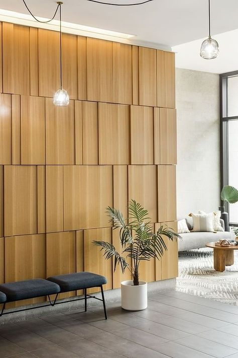 Wall Cladding Designs, Modern Bauhaus, Wood Wall Design, Feature Wall Design, Cladding Design, Staircase Wall, Wood Cladding, Lobby Design, Hanging Lamps