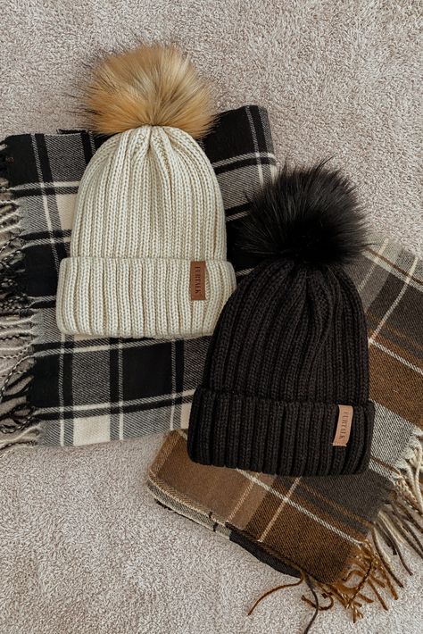 An ivory pom beanie and a black pom beanie, both from Amazon fashion. Pom Pom Hat Outfit, Yarn Beanie One Size For Winter, Affordable Crochet Beanie Hat For Gift, Cute Yarn Beanie, One Size Fits Most, Pom Beanie Outfit, Winter Yarn Beanie One Size, Womens Beanies Outfits, Pom Pom Beanie Outfit, Winter Beanie Hat, One Size Fits Most