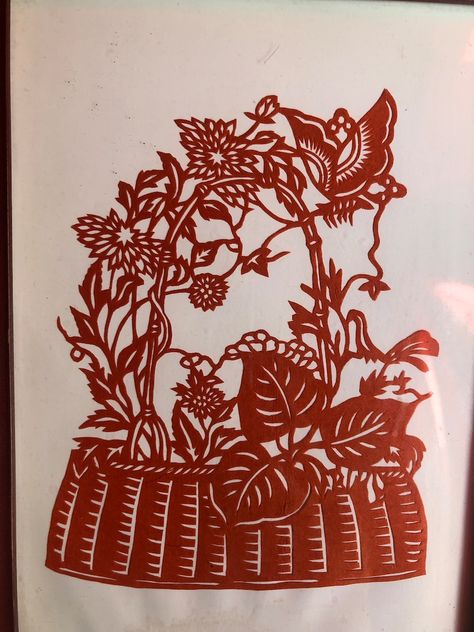 Chinese tissue paper cut out art where the cuts form the lines of the drawings. Shown here is a basket with flowers, leaves, and birds. Paper Cut Out Art, Chinese Paper Cut Art, Orange Tissue Paper, Basket With Flowers, Groovy Design, Cut Out Art, Art Chinois, Paper Cutout Art, Burnt Umber