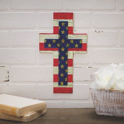 Patriotism meets faith with this find! A spiritual and star-spangled addition to Fourth of July décor, this cross sign is made in an Old Glory-inspired pattern. Hang this on memorial day and keep it up all summer…or all year! After all, it's never a bad time to show love for your country and religion. | The Holiday Aisle® Patriotic Cross Wall Decor in Blue/Red, Size 12.0 H x 7.0 W x 1.9 D in | Wayfair | Home Decor Patriotic Cross, Cross Sign, Americana Crafts, Patriotic Wall, 4th July Crafts, Bad Time, Cross Wall, Fourth Of July Decor, Cross Wall Decor