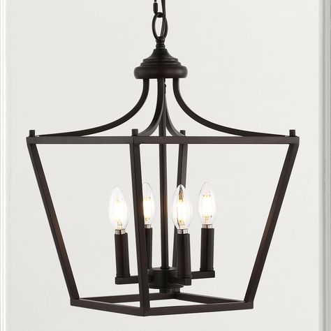 Perfectly sized for a kitchen island, breakfast table, entry or hallway, the timeless silhouette of our pendant lantern is updated with a dark oil-rubbed bronze finish. The open frame contains four candles with LED bulbs that provide warm light for a vintage touch. With its adjustable chain, this versatile lantern is ideal for a modern farmhouse kitchen, rustic entry, or traditional foyer. JONATHAN Y Camden 4-Light Oil Rubbed Bronze Farmhouse Square LED Pendant Light | JYL7561A Traditional Foyer, Swag Pendant Light, Rustic Entry, Pendant Lantern, Farmhouse Lantern, Modern Lanterns, Lantern Pendant Lighting, Black Lantern, Three Candles