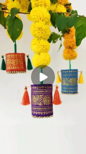 Rohini Deepthi Natti on Instagram: "#LetsGharGhar | Brocade ...let's call them Tassels?  Hubby called them Tibetan Prayer Rolls 😂   Here's next part of my Diwali decor. Fabric glue is yet to be delivered 😅 Refer to my previous reel for the brocade sleeve DIY. These silk tassels I bought are usually used for saree pallus.  Initial plan was to attach a thread but then poking sticks into it seemed more stable and easy. If you don't  have sticks, you could poke toothpicks from both ends and tape in between 😊  Satin ribbons or any fancy thread can be user to hang them instead of these garlands. Infact you can just hang them on curtain rods or trees like I did on my bougainvillea 😝  Hopefully by the time I finish making everything, LED diyas will arrive🤞Stay Tuned for the next part ❤️  #diw Tassel Hanging Decor, Diy Deepavali Decoration, Diy Tassels Decoration, Fabric Tassel Garland, How To Make Diwali Decoration, Garland Hanging Ideas, Diwali Hanging Decorations, Diwali Craft Decoration, Deepavali Decorations