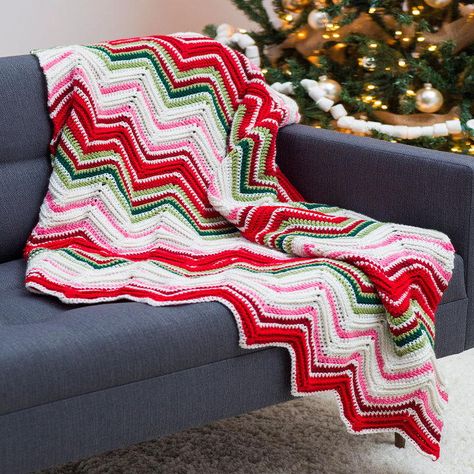 Free Christmas crochet afghan patterns are simply lovely. Make this beautiful throw and keep it on your couch all season! It's perfect for unwrapping presents. Crochet Ripple Pattern, Christmas Afghan, Christmas Crochet Blanket, Afghans Crochet, Crochet Crowd, Crochet Afghan Patterns Free, Crocheted Blanket, Crochet For Beginners Blanket, Easy Crochet Patterns Free