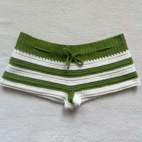 🍀Custom color requests available! 🍀 🍀Hand crocheted Green & White Summer Mini Shorts. Please note that these shorts are mini shorts, if you message me I can adjust the length to make them slightly shorter or longer. 🍀 🍀The shorts waist band is made with a soft green yarn and hugs your waist but is stretchable. The body of the shorts are made with a soft green yarn and a soft white yarn, alternating in a striped pattern. 🍀 🍀The shorts in the picture are a size Small. 🍀 White Crochet Shorts, Shorts Y2k, Crochet Bottoms, Green Yarn, Crochet Swim, Crochet Bralette, Crochet Clothing And Accessories, Crochet Shorts, Yarn Knitting