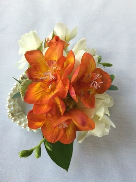 Orange & white freesia study corsage Orange And White Corsage, Orange Flower Corsage, Corsage Aesthetic, Orange Prom Corsage, Orange Corsage And Boutonniere, Orange Corsage, Freesia Wedding Bouquet, Neon Orange Dress, White Corsage