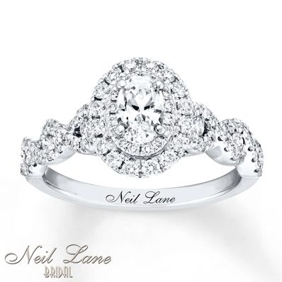 Neil Lane Bridal® rings feature modern, vintage-inspired designs that celebrate Hollywood glamour. This engagement ring showcases a 1/2 carat oval diamond as the brilliant center of attention. Sparkling round diamonds encircle the center and beautifully decorate the band of 14K white gold. The ring has a total diamond weight of 1 1/6 carats. Neil Lane's signature appears inside the band. Diamond Total Carat Weight may range from 1.145 - 1.17 carats. Radiant Rings, Bridal Diamond Ring, Neil Lane Engagement Rings, Neil Lane, Pear Engagement Ring, Diamond Bridal Sets, Dream Engagement Rings, Buying Diamonds, Dream Ring