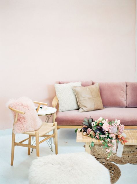 Pink and natural wood wedding lounge, mauve pink velvet sofa and wicker wishbone chair with pink pillow, wicker coffee table and fluffy white ottoman, Amorology and Cavin Elizabeth Photography Romantic Rehearsal Dinner, Modern Pink Wedding, Black And Pink Wedding, Wedding Lounge Furniture, Pink Velvet Sofa, White Ottoman, Pink And White Weddings, Wicker Coffee Table, Pink Wedding Inspiration