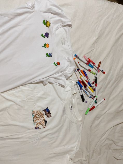 Two white t shirts drawn on with fabric markers one has flowers one has a bear Fabric Marker Shirt, Fabric Markers Diy T Shirts, Fabric Marker Ideas, Marker Ideas, Diy Marker, Its Raining, Fabric Markers, T Shirt Diy, Diy Shirt