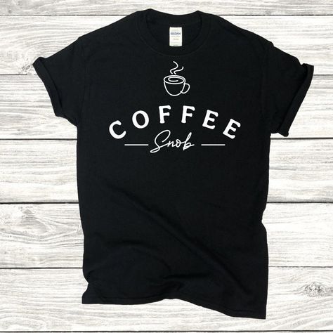 "Introducing the \"Brew-tiful Moments\" Coffee Lover's T-shirt - a must-have for caffeine enthusiasts who savor every drop of their favorite brew! Crafted with passion and designed for comfort, this tee is the perfect blend of style and statement for your everyday coffee ritual. 🌟 Design: Featuring a whimsical and eye-catching design, our \"Brew-tiful Moments\" T-shirt proudly celebrates the art of coffee. A steaming cup, aromatic coffee beans, and a playful coffee mug create a charming and unique graphic that resonates with the true coffee aficionado. ☕ Comfort: Made from premium, soft cotton, this shirt ensures a cozy fit that's perfect for lazy mornings at your favorite coffee spot or those late-night coffee-fueled study sessions. The lightweight and breathable fabric make it an ideal Coffee Uniform, Coffee Shirt Ideas, Art Of Coffee, Coffee T Shirt, Night Coffee, Funny Coffee Shirts, Coffee Ritual, Steaming Cup, Star Coffee