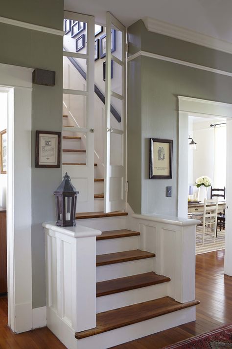 Southern Newlywed: At Home with Lucky Luxe - Southern Weddings Magazine Middle Of House Staircase, Kitchens With Stairs To Upstairs, Closing Off Basement Stairs, Top Of Stair Door Ideas, Stairs Location Ideas, Staircase Near Kitchen, Door At The Top Of The Stairs, Stairs In The Middle Of The Room, Erin Napier Paint Colors