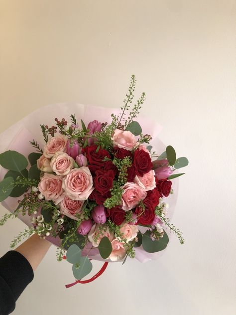 a hand tied bouquet with pink and red flowers Hoco Flowers, Pink Graduation, Pink And Red Flowers, Spring Flower Arrangements, Red Bouquet, Hand Tied Bouquet, Spring Flower, Pink And Red, Red Flower