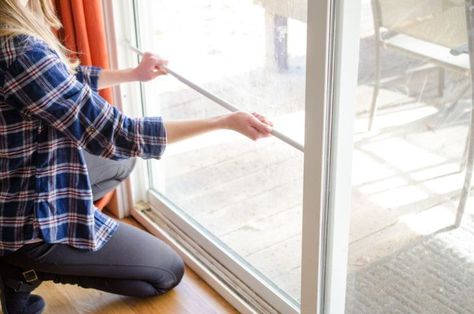 If you have a sliding door, then you know how easy it is to open compared to other doors. This can cause problems if you have young children or live in a less-than-safe neighborhood. To prevent children from opening the sliding door from the inside and burglars from the outside, place a tension rod in the door. Tension Rod Curtains, Hanging Potted Plants, Tall Kitchen Cabinets, Tension Rods, Hanging Folders, Craft Station, Safe Neighborhood, Spice Storage, Tension Rod