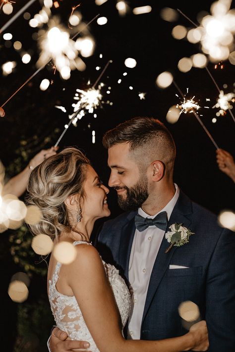 Husband and Wife on wedding day hugging with bright sparklers surrounding them Sparklers Wedding Pictures, Wedding Sparklers Photos, Sparkler Exit Wedding, Wedding Group Photos, Night Wedding Photos, Wedding Photo List, Wedding Fotos, Buffalo Wedding, Wedding Exit