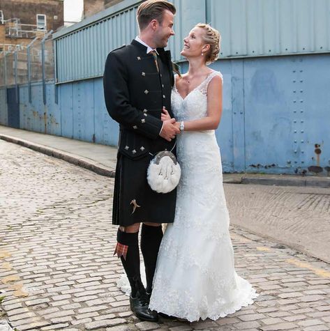 Brilliantly bold in black, this groom has chosen a seriously smart kilted with striking metal studs and cute tartan detailing on the socks and tie. His bride is dressed beautifully in a classic white wedding dress with lots of embroidery and detailing. What a stunning pair, we would definitely steal their kilt wedding style in a heartbeat. Black Kilt Wedding, Kilt Fashion, Wedding Kilt, Kilt Wedding, Black Kilt, White Strapless Wedding Dress, Ivory Wedding Flowers, Funny Wedding Pictures, Sgian Dubh