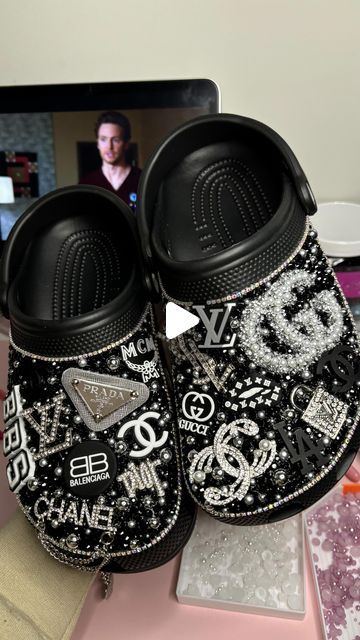 Blinged By Liy 🫶🏽 on Instagram: "Custom black designer bling crocs 💋🖤

 
- FOLLOW @blingedbyliy FOR MORE 💕 

Want to learn how to customize shoes like me? Click the link in my bio to watch my how to videos and join my group chat 🫶🏽

- The quickest and easiest way to get a response is by following the messaging prompt located on my page! 💕 
✨PLEASE BE PATIENT AND RESPECTFUL ✨

#customcrocs #blingedoutcrocs #blingedout #blingcrocs #customs #custommade #customcrocs #blingshoes #blingbling #crocs #designercrocs #theyenvyliy #crocswomen #customshoes #blingedbyliy #757artist #757art #crocgirlsummer #crocgirl #crocs #customeverything #blingbling #blackowned #blackgirlmagic #smallbusinessowner #largebusinessowners" Chanel Crocs Shoes, Blinged Out Black Crocs, Croc Ideas Black, How To Bling Crocs Diy, Black Custom Crocs, Black Bling Crocs, Crocs Diy Ideas, Diy Crocs Shoes, Crocs Rhinestone