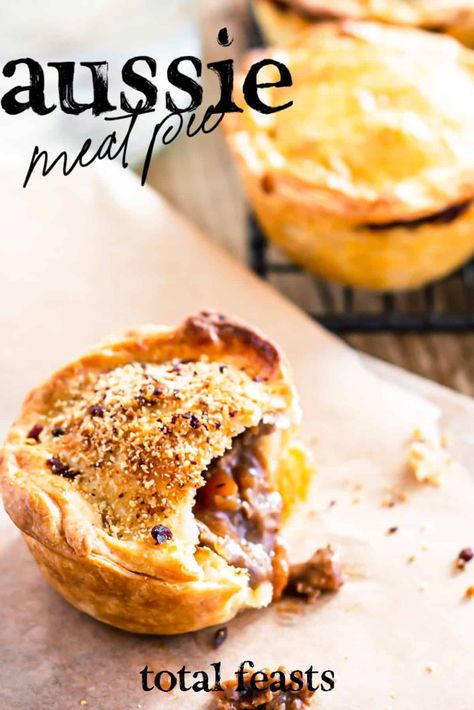 An Australian classic: the Aussie Meat Pie. Rich and flakey crust, deep savoury filling - topped off with tomato sauce. We've added a bacon topper for extra oomph. Australian Pie, Aussie Meat Pie, Aussie Pie, Australian Meat Pie, Sour Cream Pastry, New Zealand Cuisine, Meat Pie Recipe, Aussie Food, Pie Crust Recipes